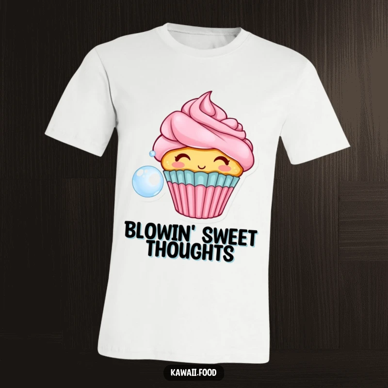Funny t-shirt depicting a happy cupcake with luscious frosting hair, blowing a giant bubble with a playful expression.